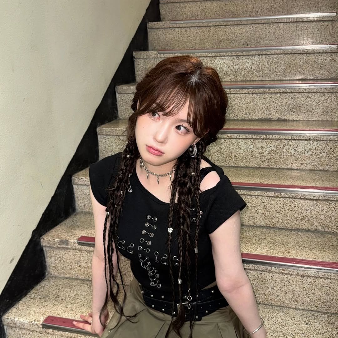Photo by 김채현 KIM CHAEHYUN on August 22, 2025. May be an image of 1 person, braids, top and text.