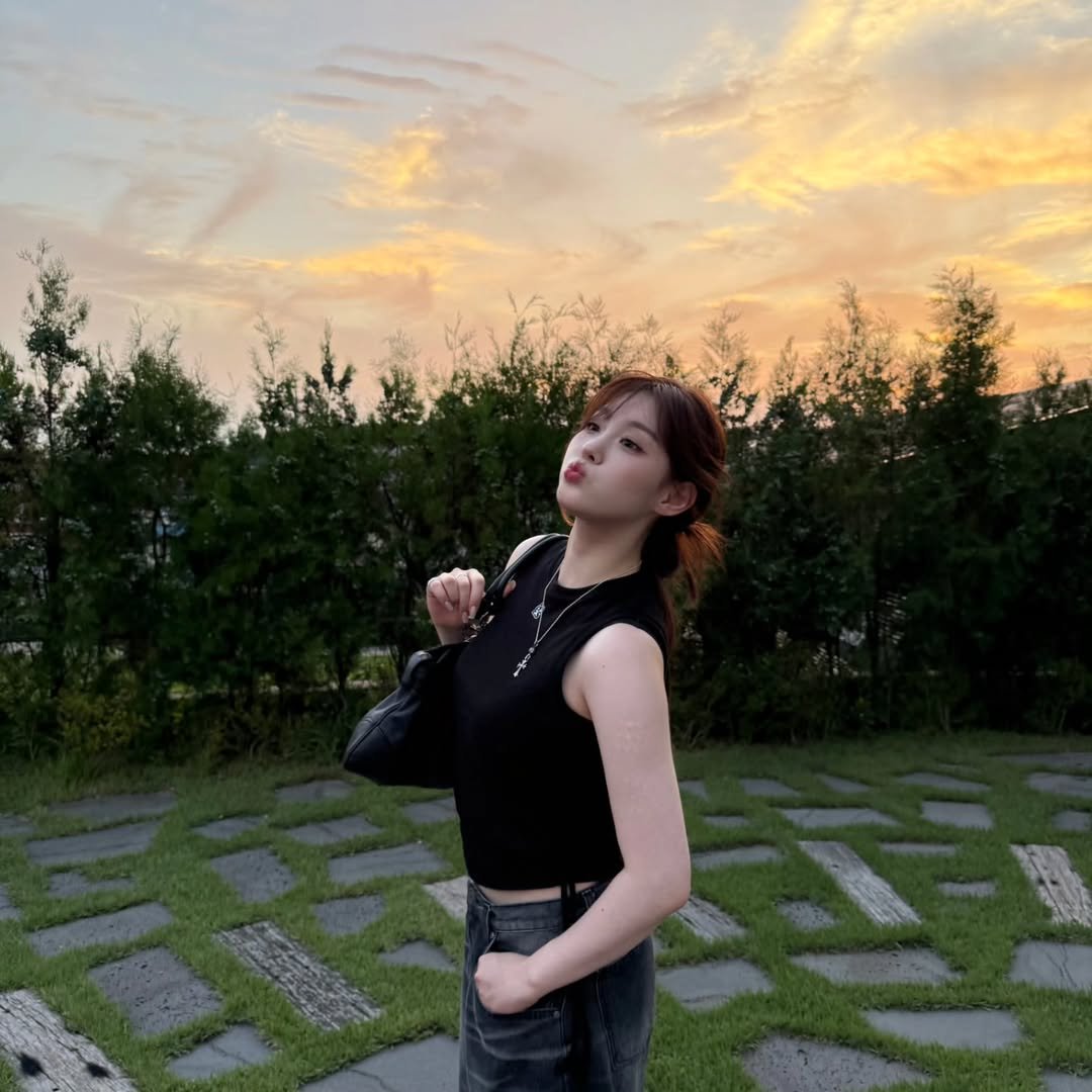 Photo by 김채현 KIM CHAEHYUN on August 12, 2025. May be an image of 1 person, hair, top, outdoors and text.