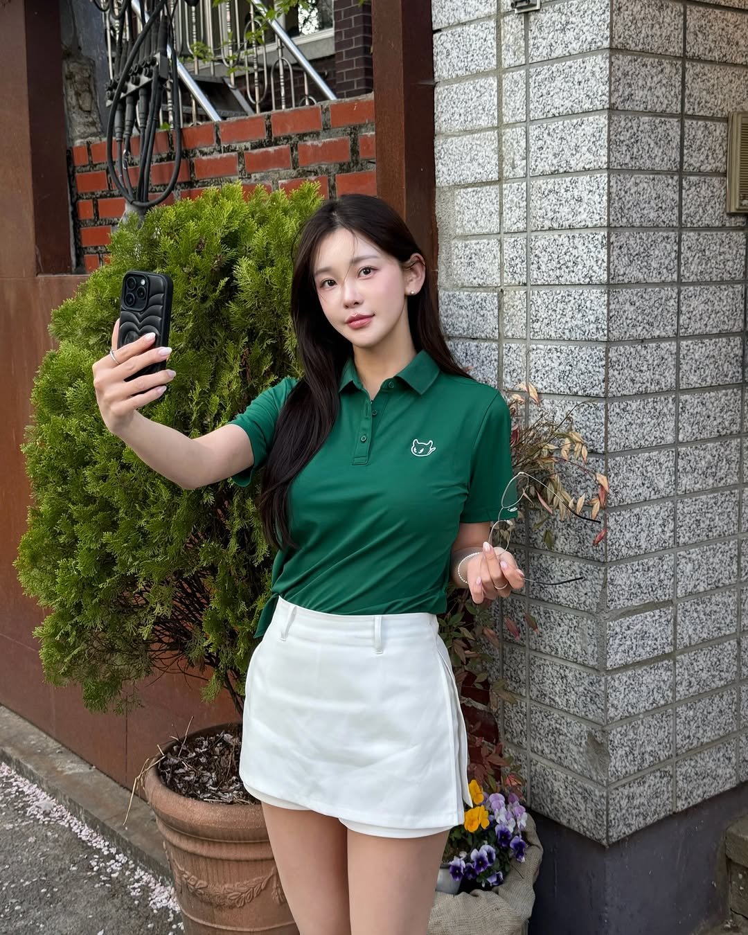 Photo shared by 김 윤희 on April 10, 2026 tagging @waacgolf, and @byhyeres. May be an image of top, miniskirt and text.