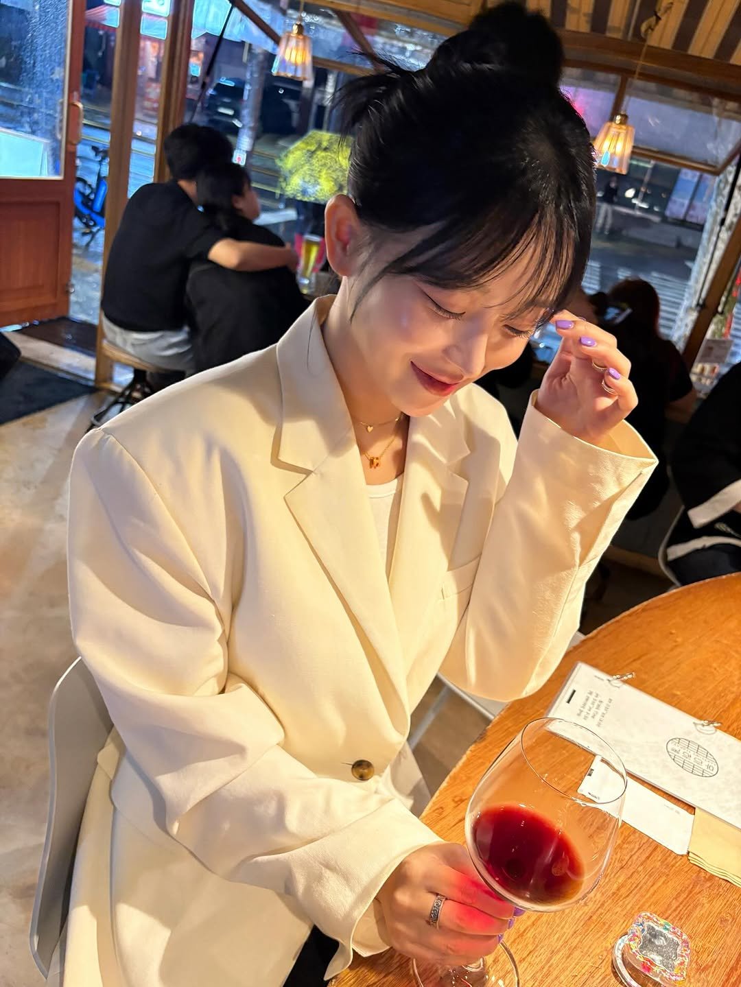 Photo by 임재원 on October 16, 2025. May be an image of one or more people, hair, duffle coat, drink, blazer, jacket, parka and text.