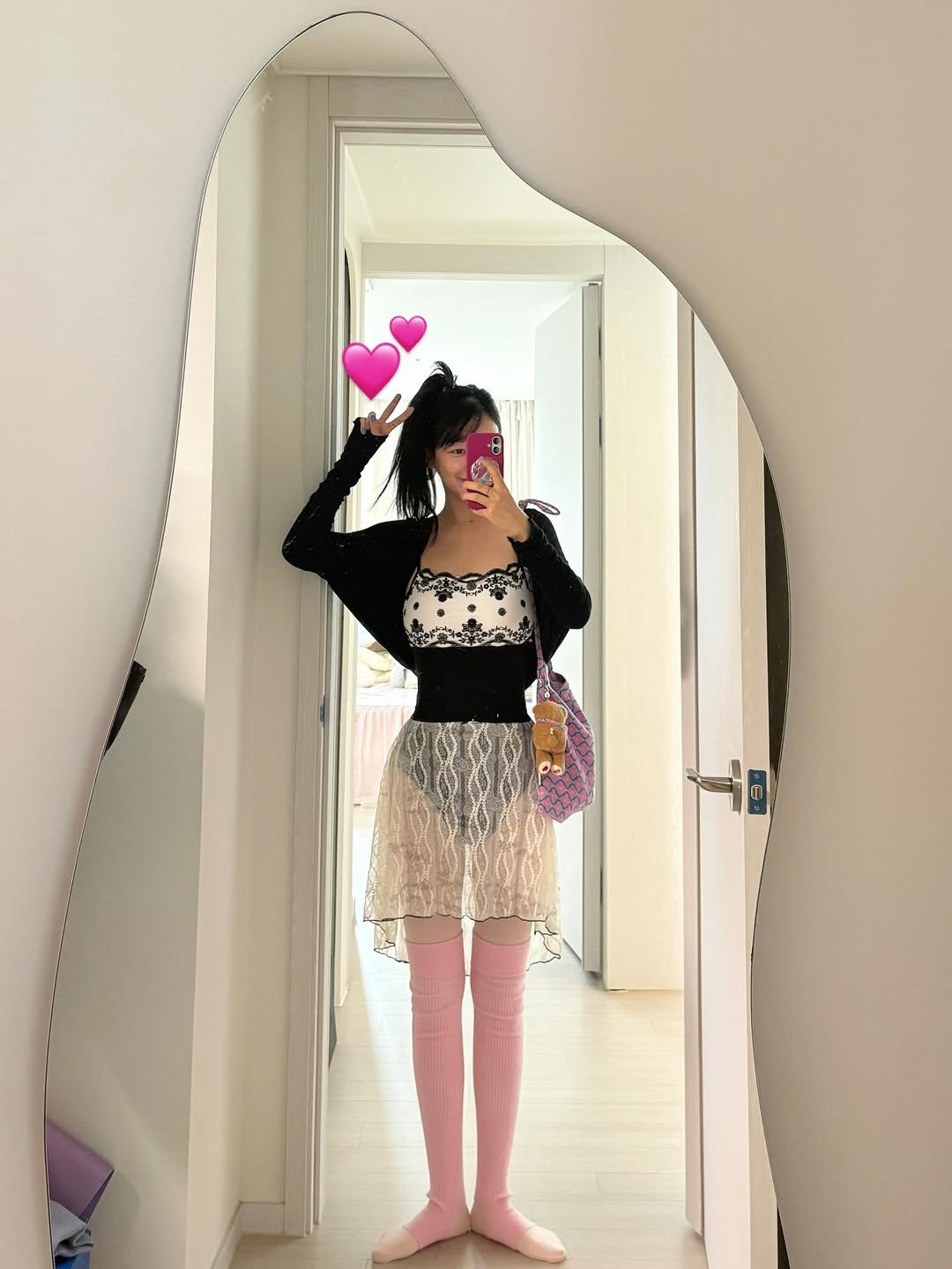 Photo by 임재원 on October 21, 2025. May be an image of fishnet stockings, miniskirt, tights and text.