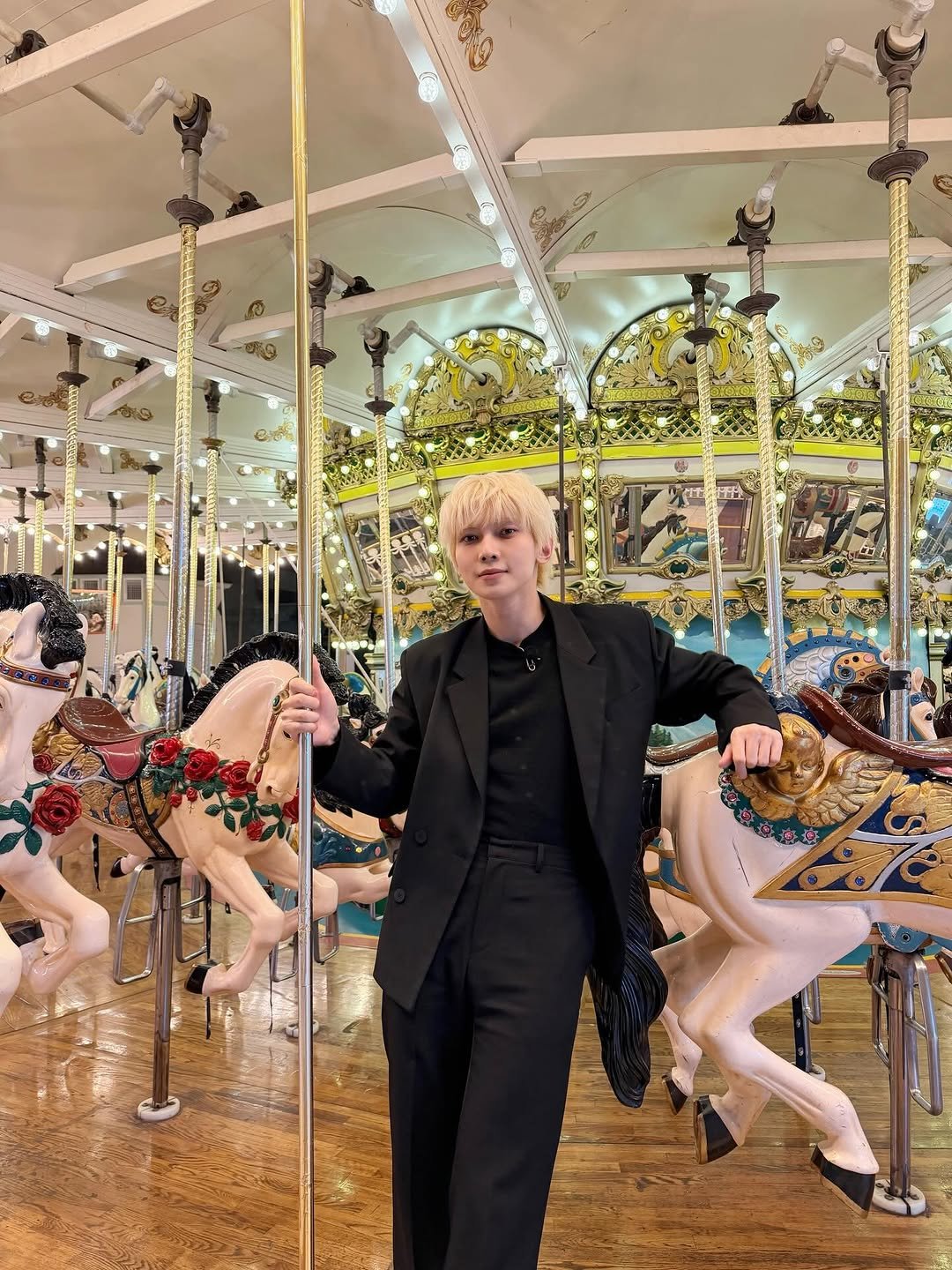 Photo by 여상 (YEOSANG) on February 11, 2026. May be an image of overcoat, dinner jacket, carousel and text.