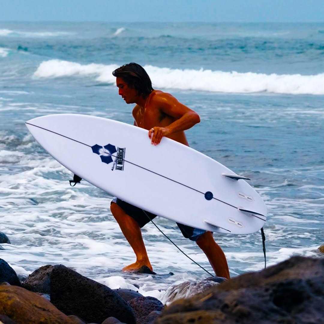 Photo by Imaikalani deVault on March 20, 2026. May be an image of surfboard, wetsuit, water and text.