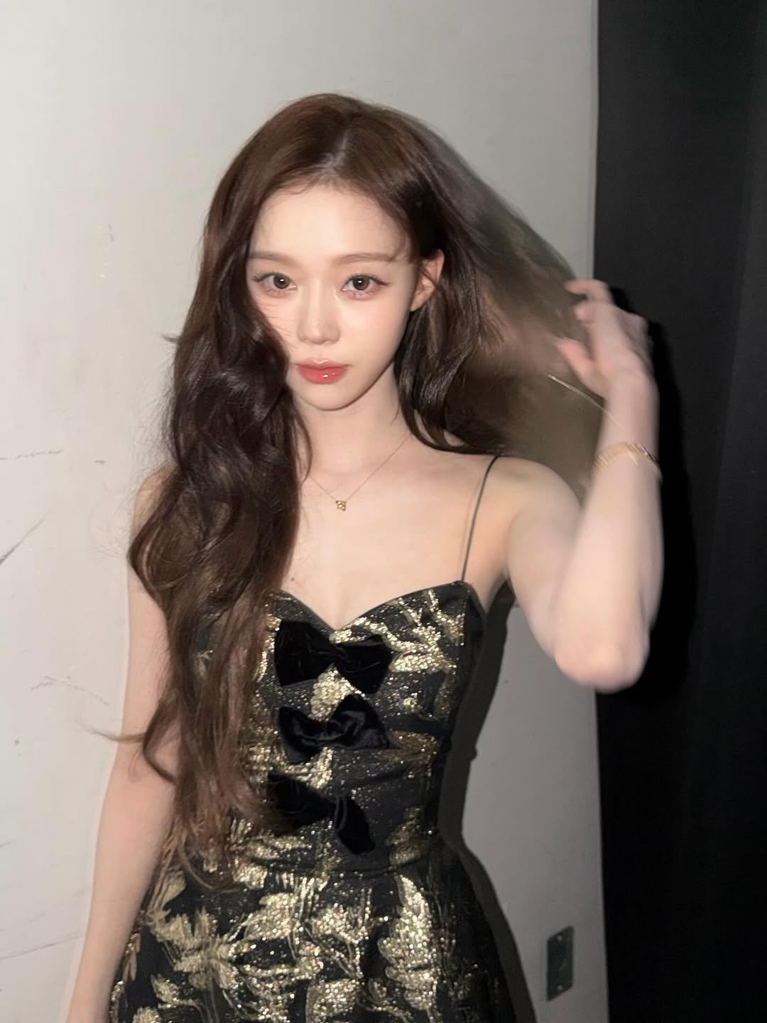 Photo by WINTER on December 20, 2025. May be an image of one or more people, hair, top, dress and text.