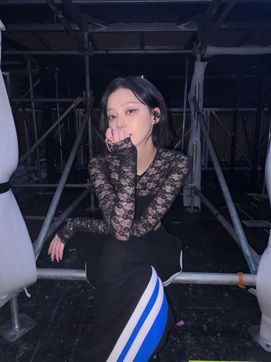 Photo by WINTER on February 08, 2026. May be an image of one or more people, hair, top, fishnet stockings and text.