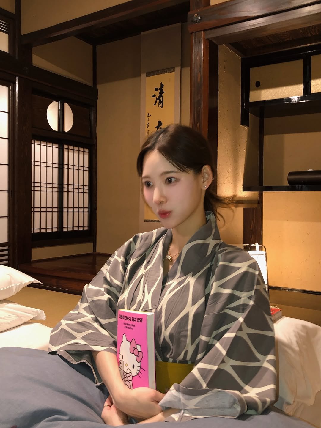 Photo by 이나연 on December 28, 2025. May be an image of sleepwear, robe, bath robe and text.