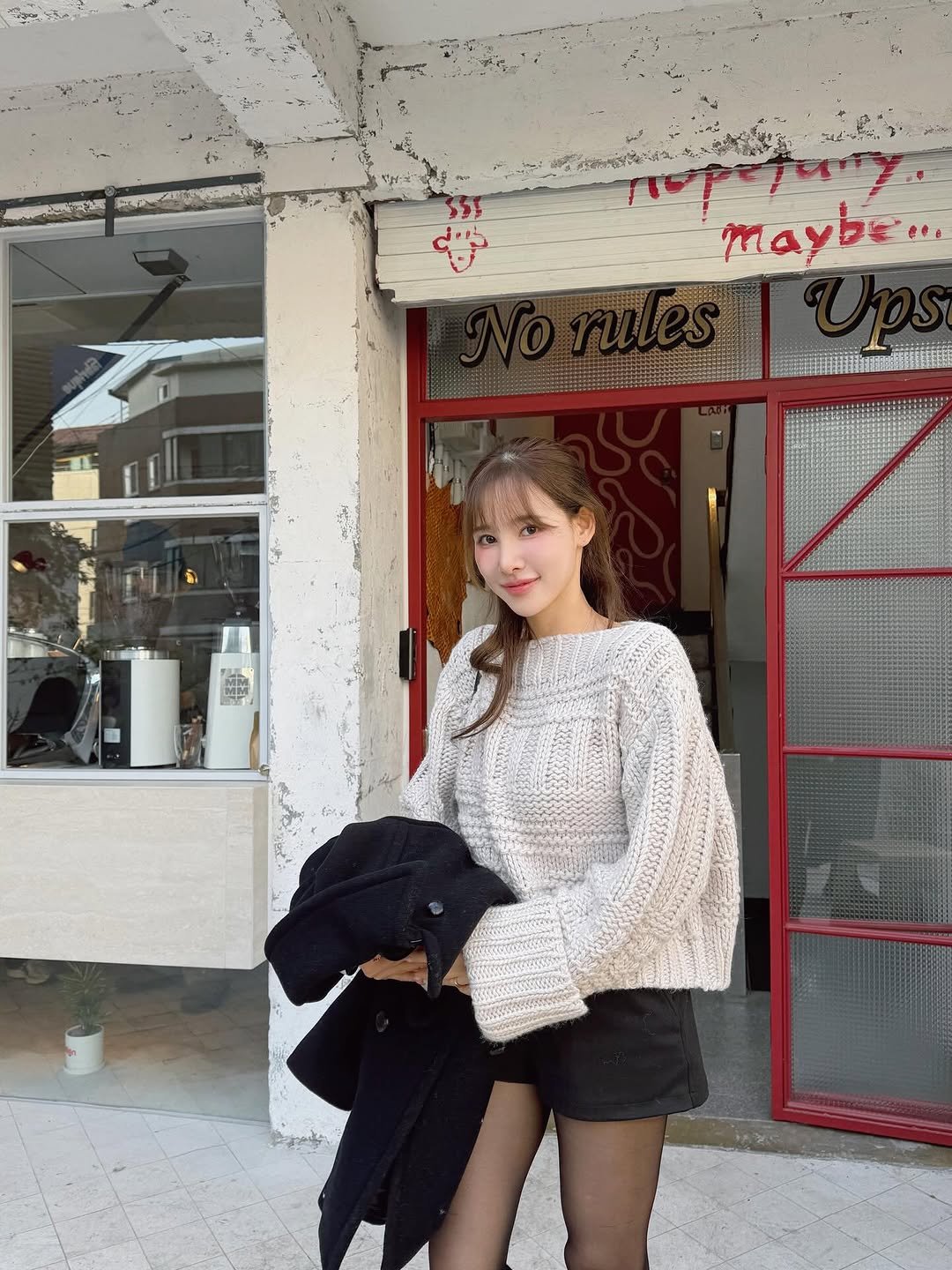 Photo by 이나연 on November 14, 2025. May be an image of one or more people, hair, duffle coat, parka, miniskirt, top, turtleneck, fishnet stockings and text.