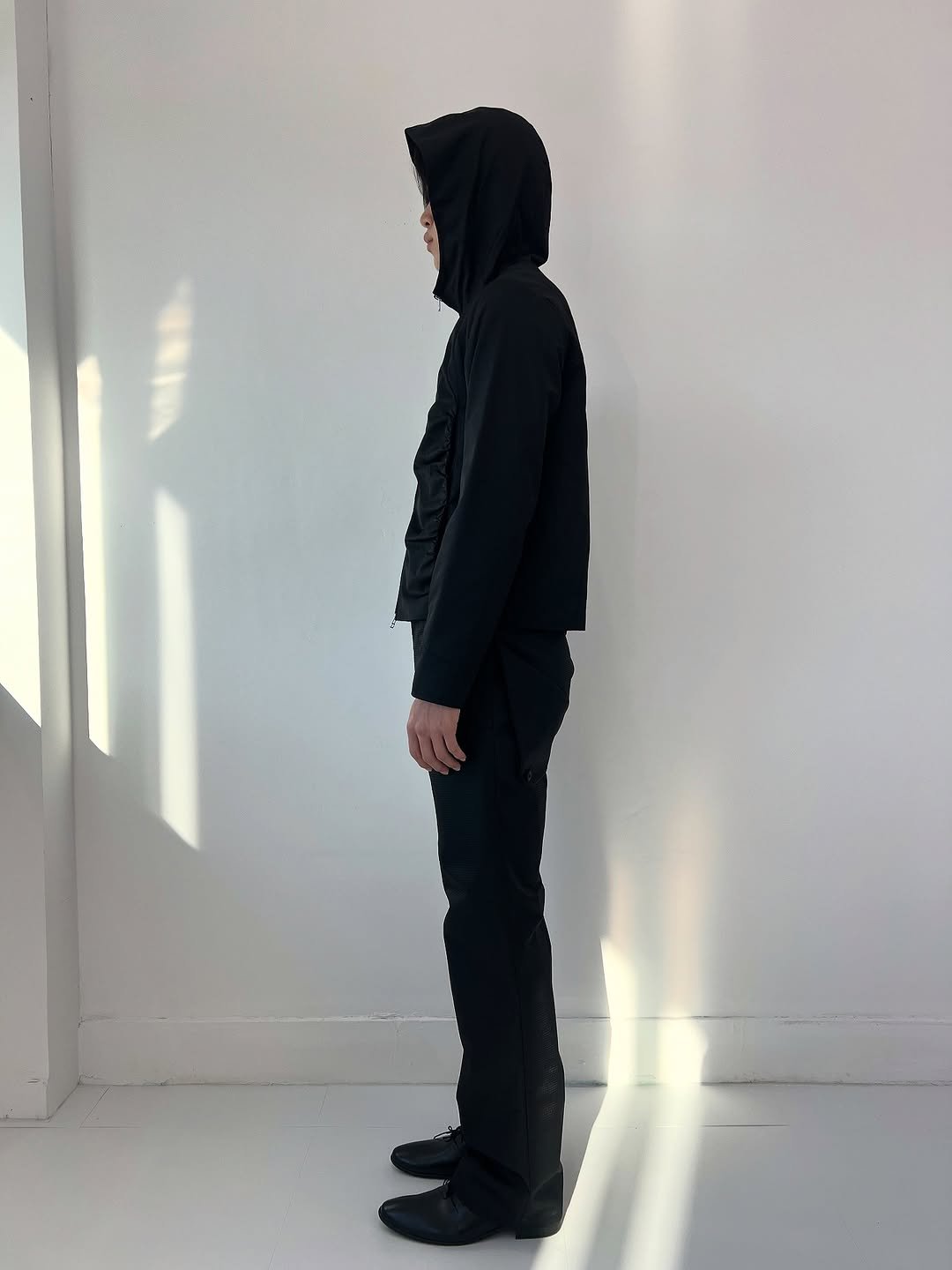 Photo by Inside the Emotion on November 09, 2025. May be an image of standing, overcoat, cloak, parka and text.