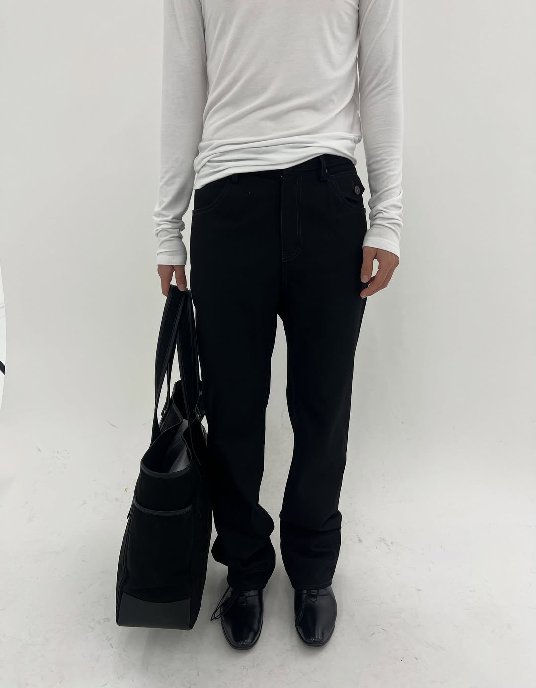 Photo by Inside the Emotion on December 01, 2025. May be an image of sweatpants, turtleneck, drawstring and text.