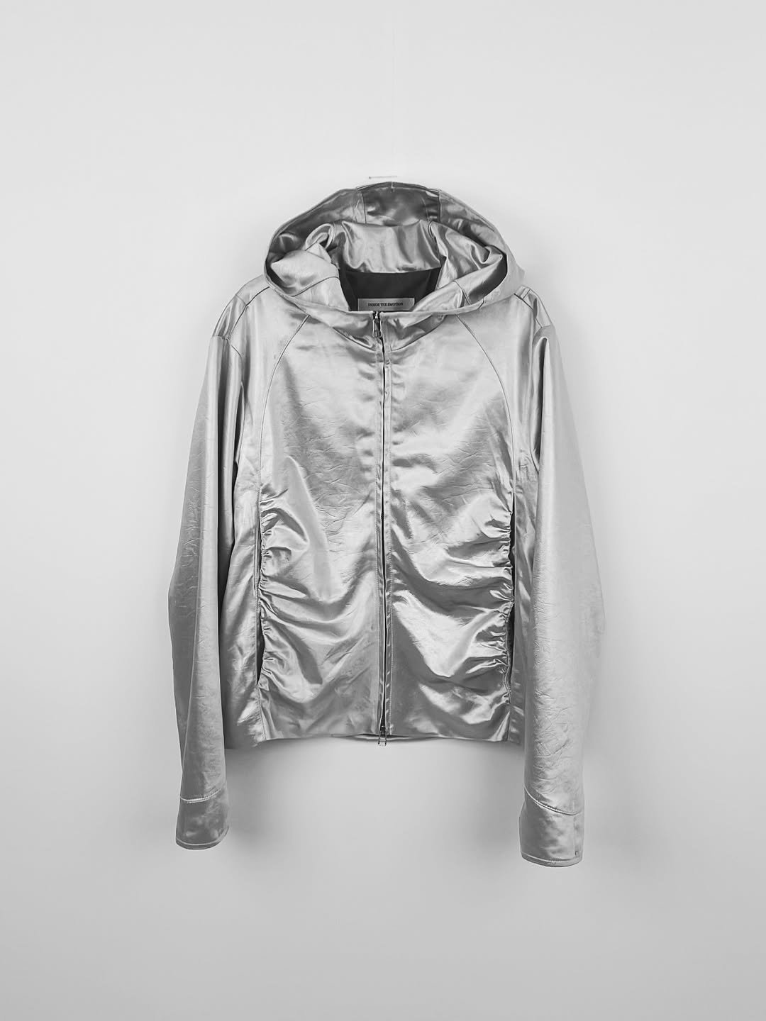 Photo by Inside the Emotion on November 19, 2025. May be an image of raincoat, parka, flight jacket, fleece and text.