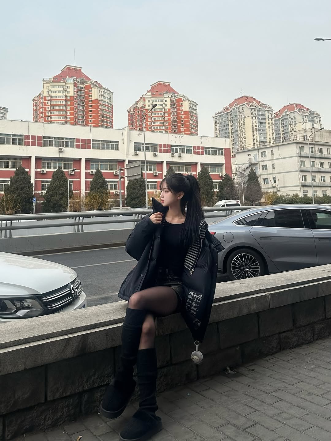 Photo by 네오 on February 09, 2026. May be an image of overcoat, parka, street, road and text.