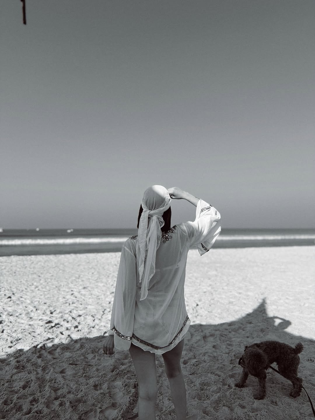 Photo by Isha Borah on January 06, 2026. May be a black-and-white image of towel, headscarf, sarong, beach and text.