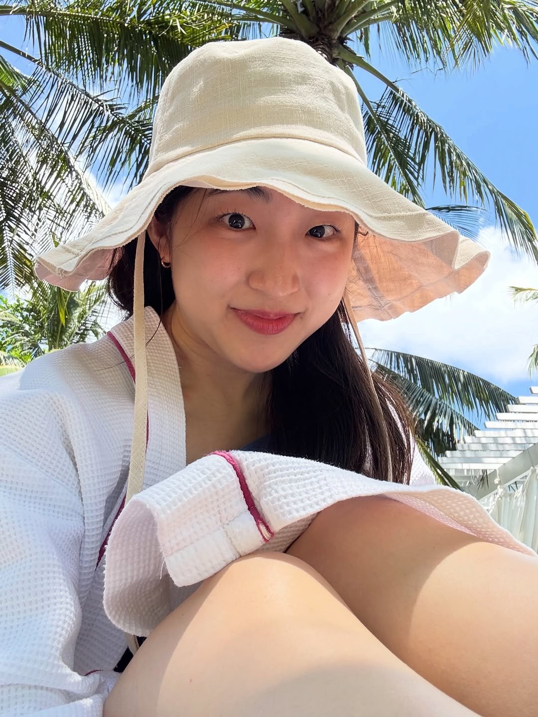 Photo by 최이솔 • Isol Choe on April 04, 2026. May be an image of hat, deck chair, bath robe, pool and text.