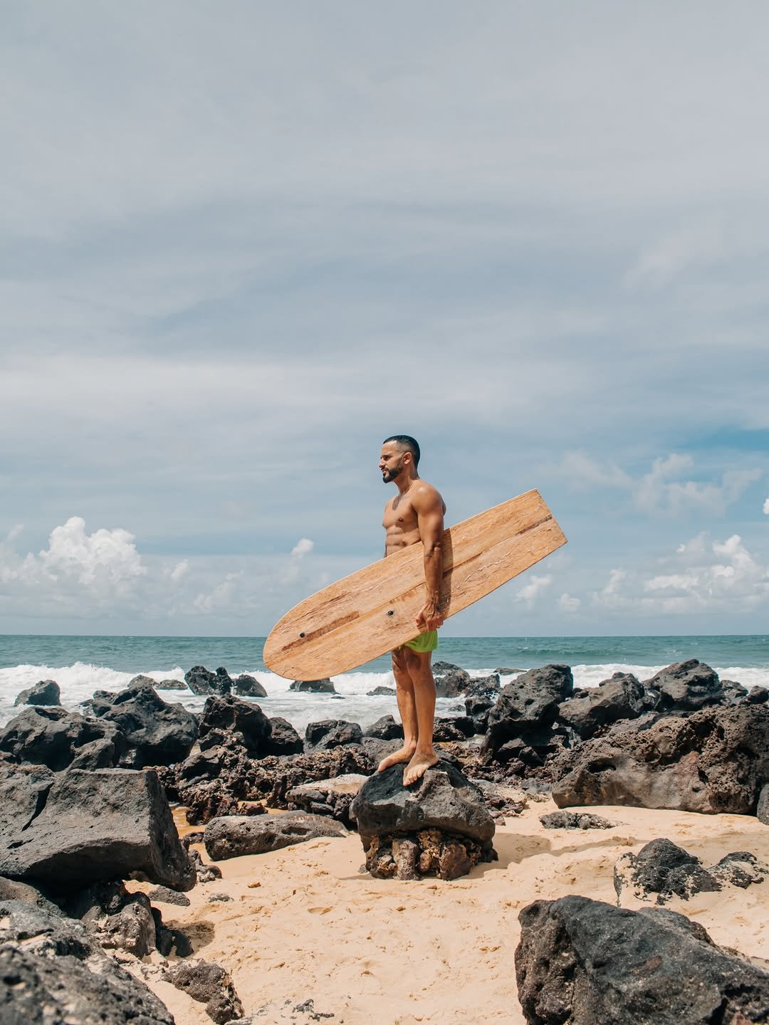 Photo shared by Italo Ferreira on February 27, 2026 tagging @aquacocobrasil. May be an image of surfboard, wetsuit, sarong, ocean, water, beach and text.