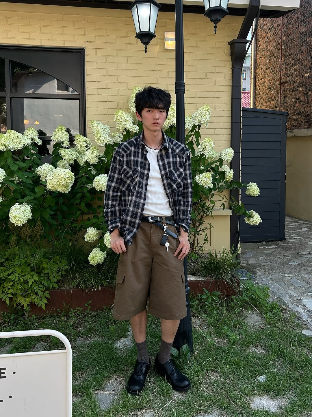 Photo by 정재훈 | CAON on August 06, 2025. May be an image of 1 person, wingtip shoes, bolo tie, kilt, bowler hat and text.