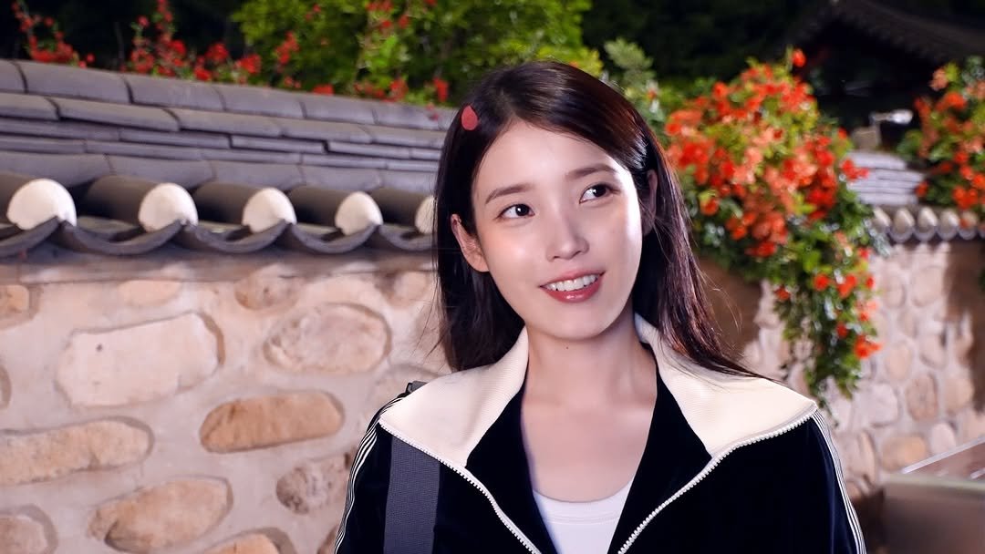 Photo shared by 아이유(IU) on April 21, 2026 tagging @dlwlrma. May be an image of one or more people, hair and text.