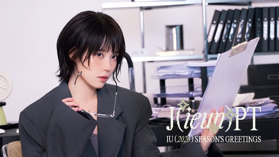 Photo shared by 아이유(IU) on November 07, 2025 tagging @dlwlrma. May be an image of one or more people, hair, suit, blazer and text that says 'Kieun KieunPT PT IU(2020)SEASONSGREETINGS IU(2026)SEASON'S IU U(2026) SEASON'S GREETINGS'.