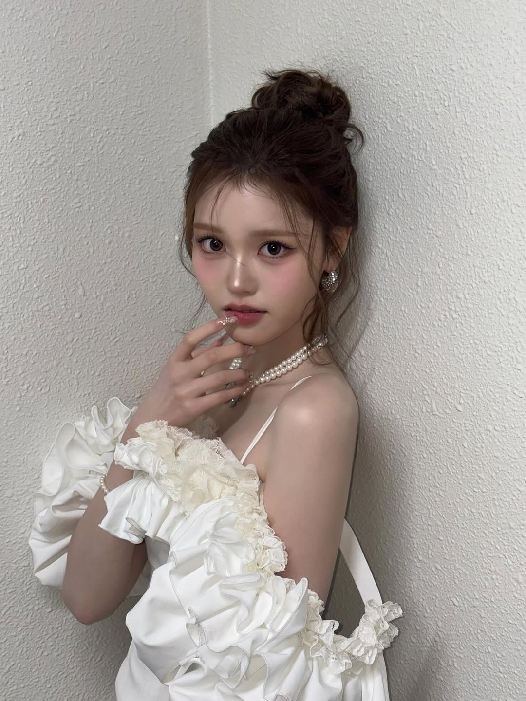 Photo by izna (이즈나) on January 05, 2026. May be an image of one or more people, braids, dress and text.