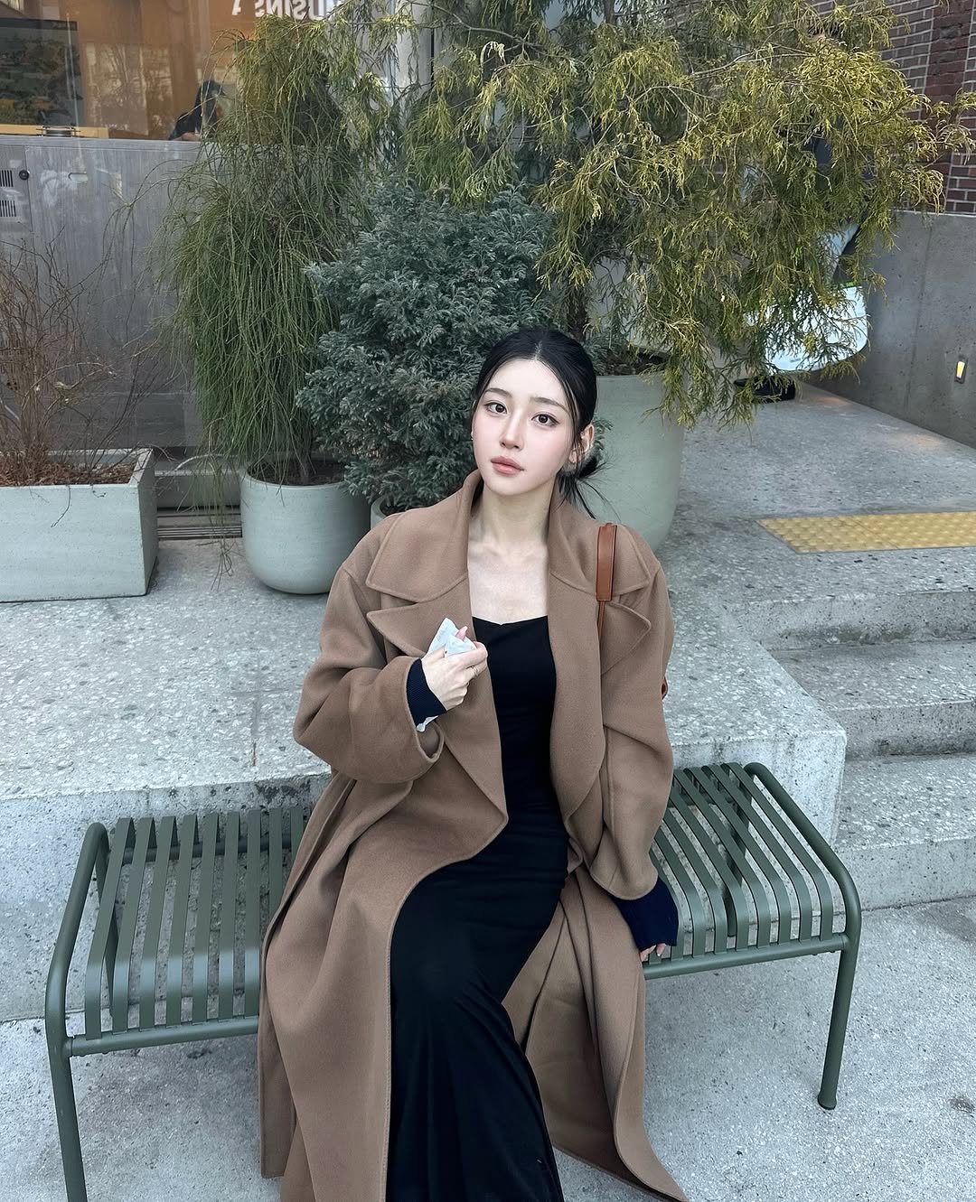 Photo shared by J on March 08, 2026 tagging @maxmara. May be an image of sable coat, duffle coat, overcoat, parka, jacket, turtleneck and text.