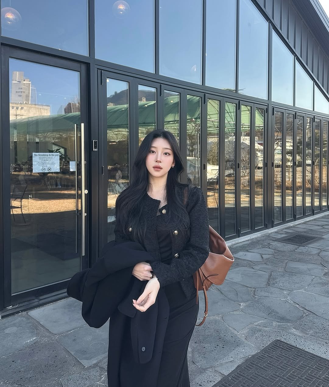 Photo by J on February 15, 2026. May be an image of overcoat, duffle coat, parka, turtleneck, cornflower and text.