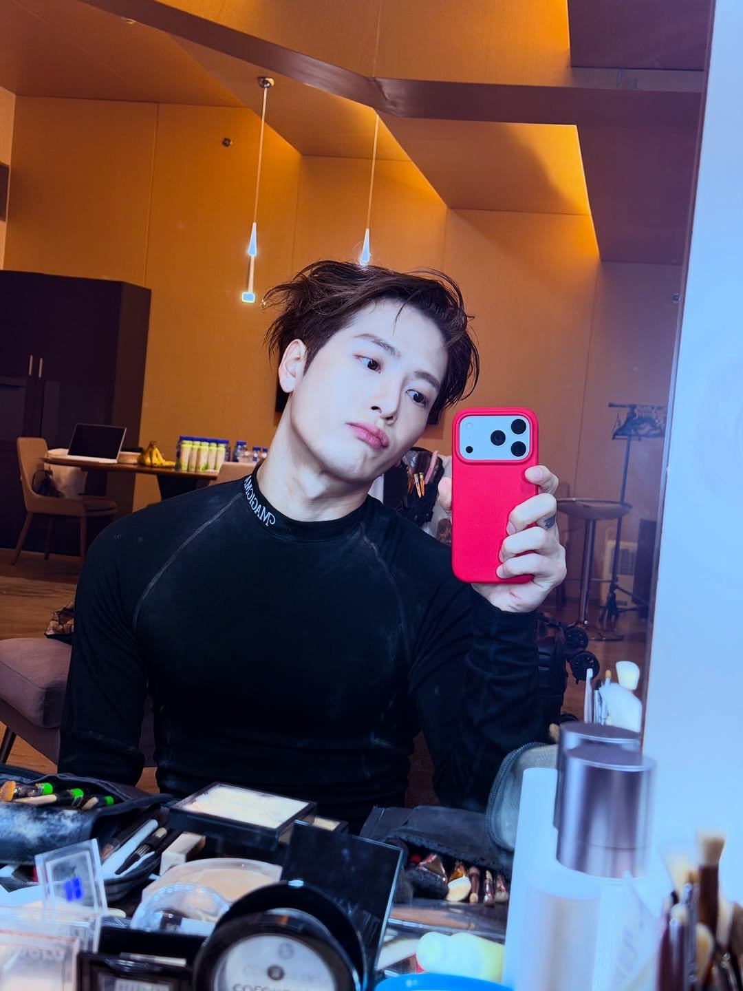 Photo by Jackson Wang on January 01, 2026. May be a selfie of one or more people, makeup, hair, mirror, turtleneck and text.