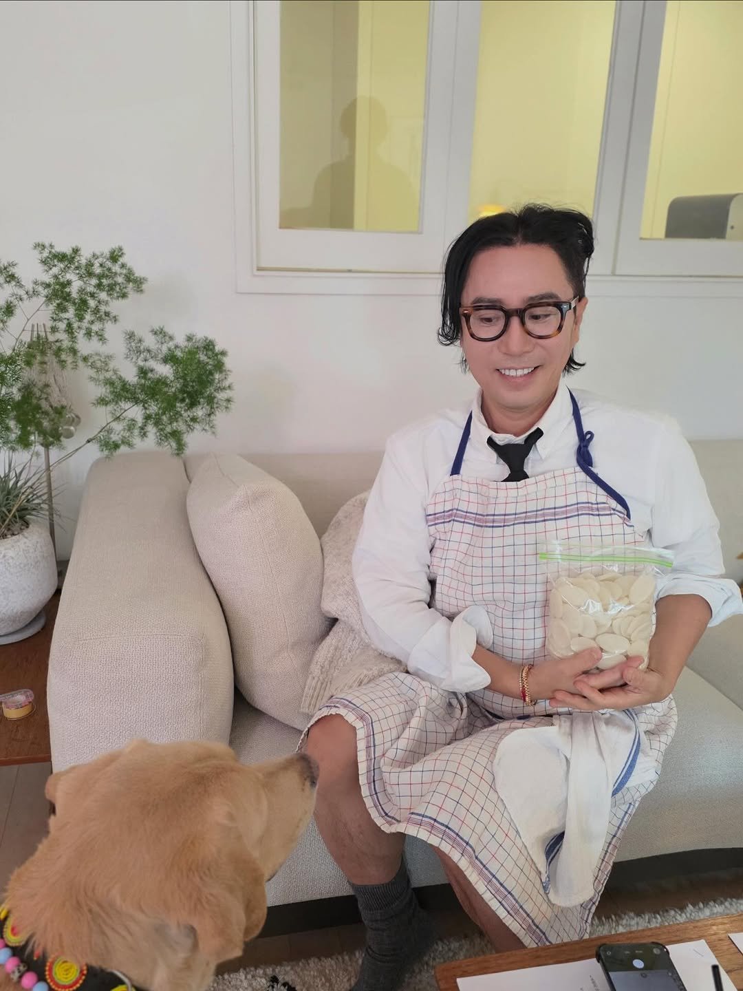 Photo shared by 정재형 on February 07, 2026 tagging @0430_live_boy. May be an image of apron, petfood and text.