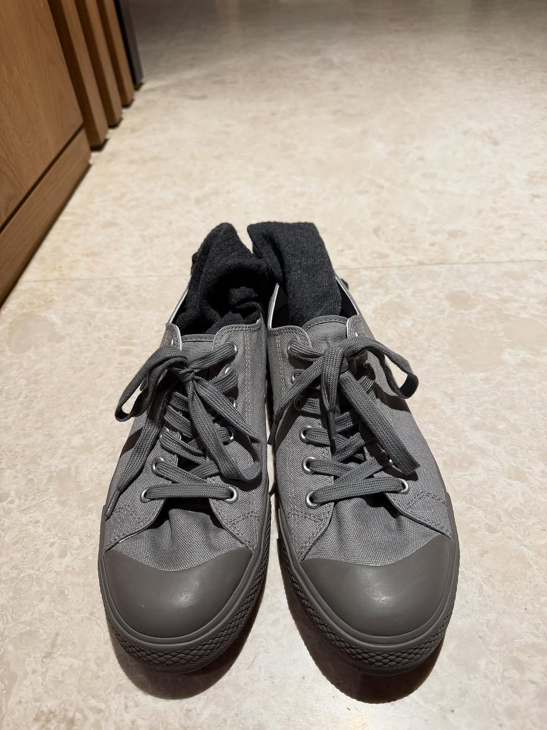 Photo by 정재형 on October 30, 2025. May be an image of wingtip shoes, toecap shoes, sneakers and text.