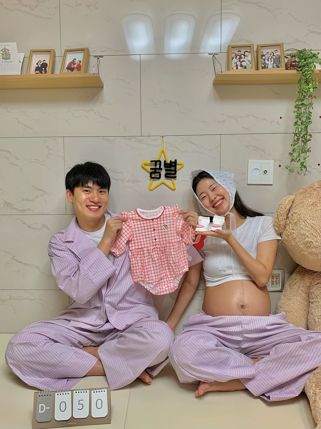 Photo shared by 지훤 on August 06, 2025 tagging @jaehhhhhhhhhh. May be an image of 2 people, sleepwear, bath robe, robe, diaper and text.