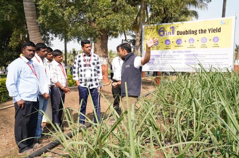 Photo shared by Jain Irrigation Systems Ltd. on January 16, 2026 tagging @betteryields_greaterprofit, @jainplumbing, @jainpipes_, and @jainsolar_. May be an image of one or more people, people standing, poster, sugarcane, banner, plant, grass and text.