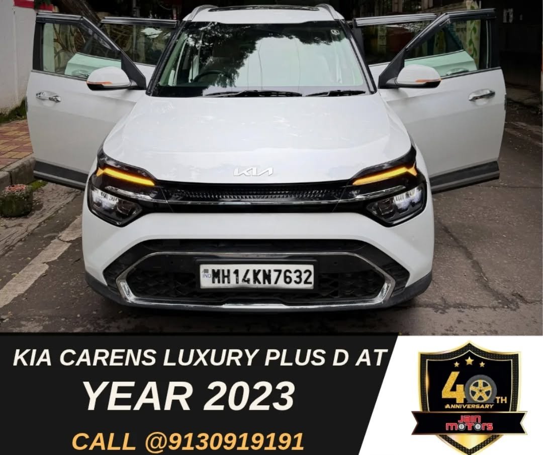 Photo by JAINMOTORS PUNE on November 14, 2025. May be an image of ‎wheel, sedan and ‎text that says '‎紅奈 B مئم K.MH 開 MH14KN7632 KIA CARENS LUXURY PLUS D AT YEAR 2023 CALL @9130919191 4 4木 TH ANNIVERSARY RSAR NNI MOTers‎'‎‎.