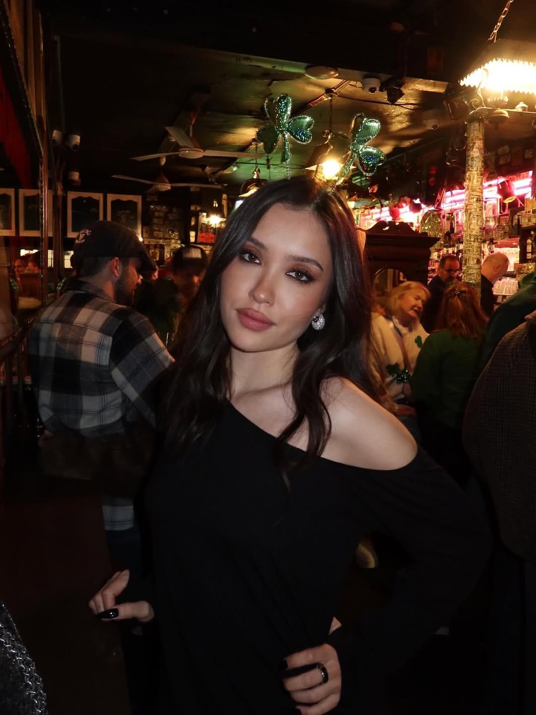 Photo by Janelle Zharmenova on March 18, 2026. May be an image of one or more people, drink, night and text.