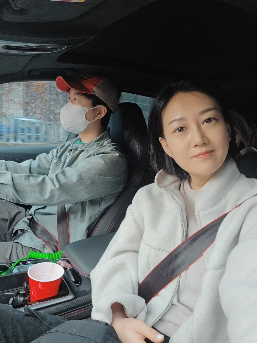 Photo by 장윤정 on November 23, 2025. May be a selfie of car, seatbelt, parka, road and text.