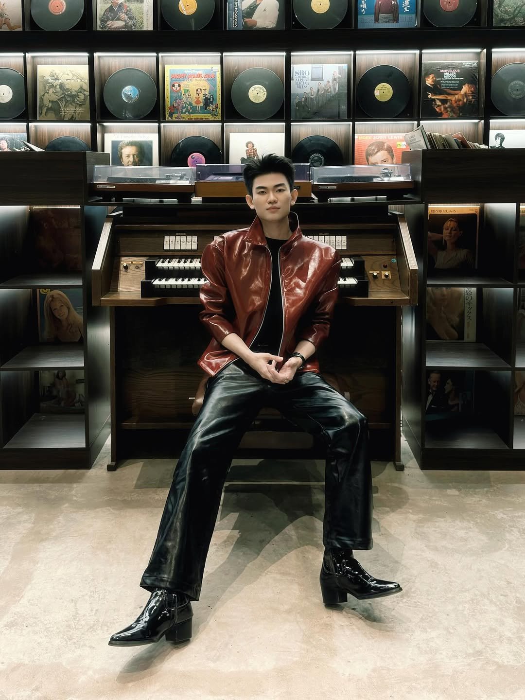Photo by Trần Võ Nhật Kiên on April 12, 2026. May be an image of suit, record player, leather, record, bolo tie, stereo and text.