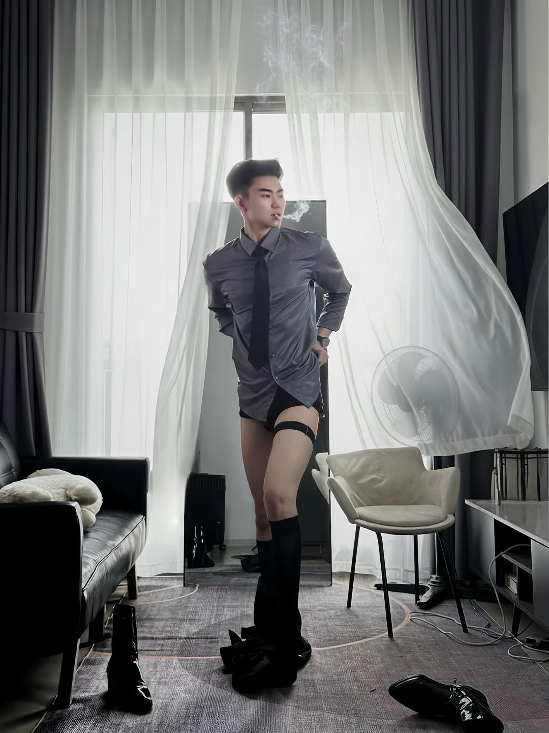 Photo by Trần Võ Nhật Kiên on January 11, 2026. May be an image of suit, underwear, cigarette and text.