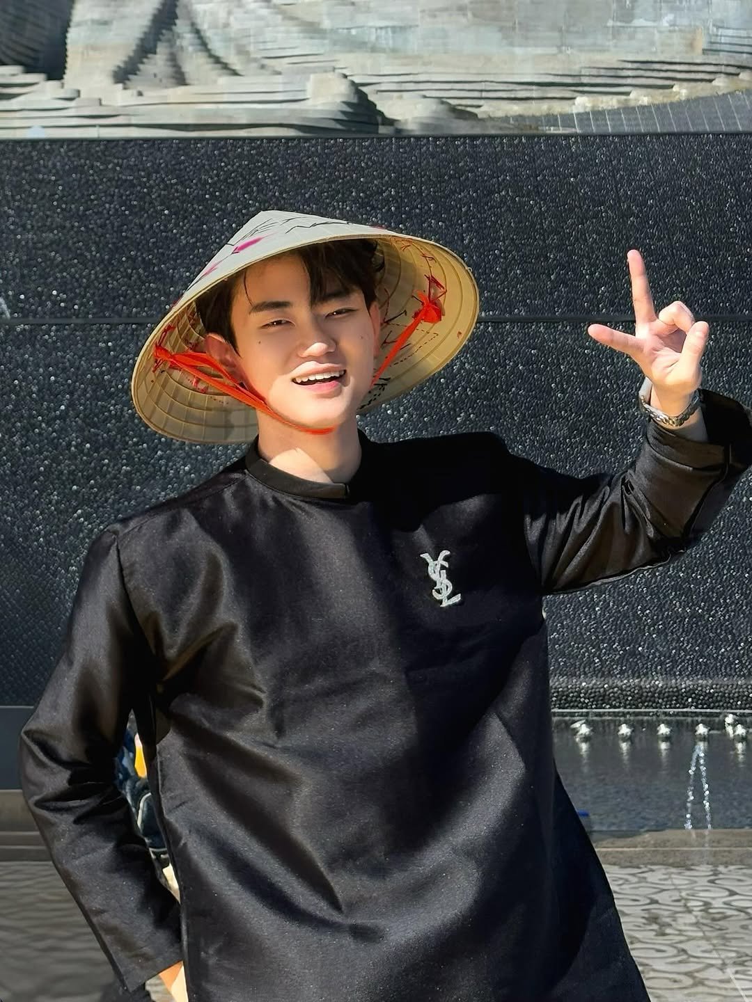 Photo by Trần Võ Nhật Kiên on September 26, 2025. May be an image of hat, sweatshirt, beret, monument, fountain and text.