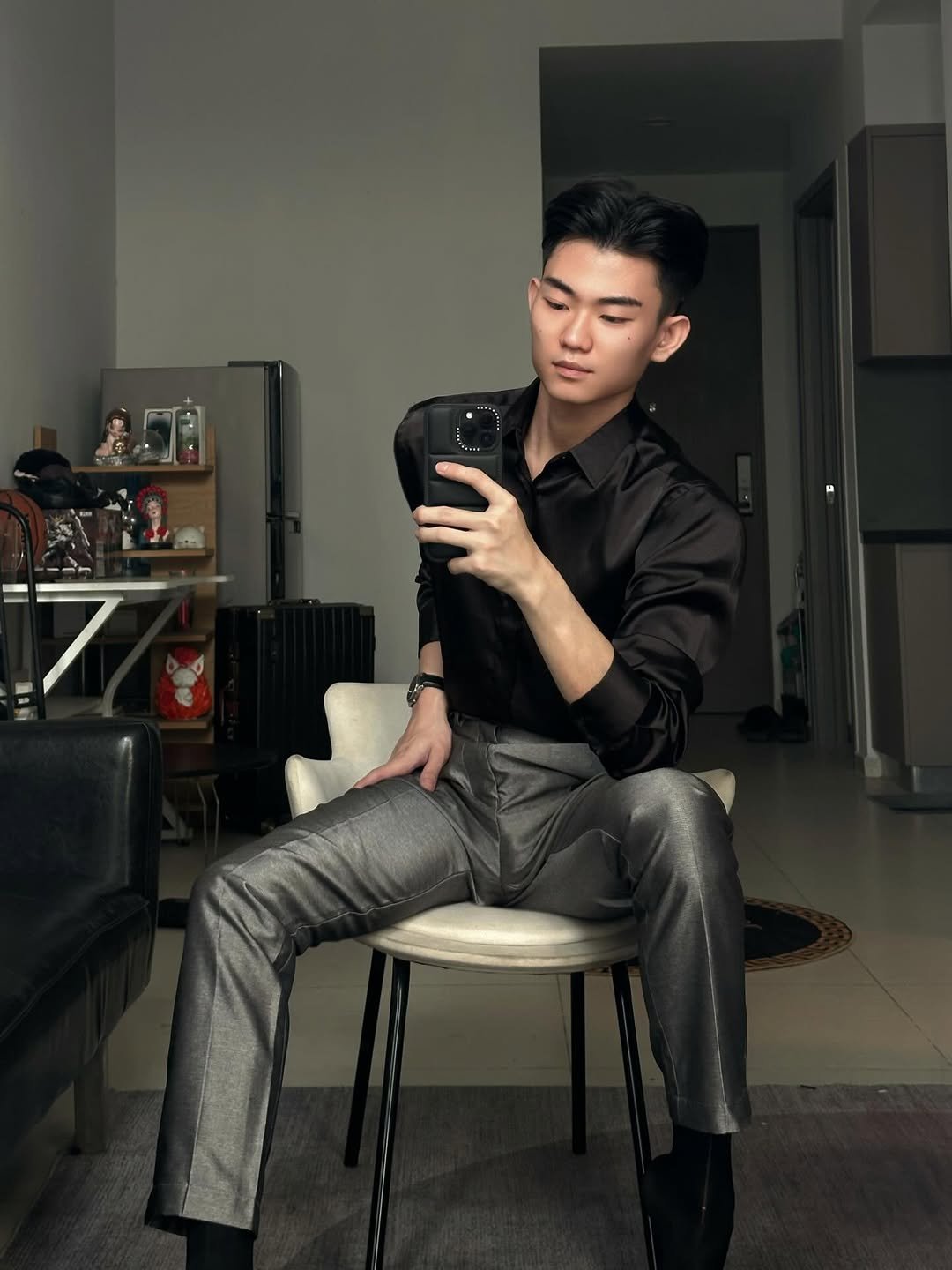 Photo by Trần Võ Nhật Kiên on January 12, 2026. May be a selfie of one or more people, wingtip shoes, suit, mirror and text.