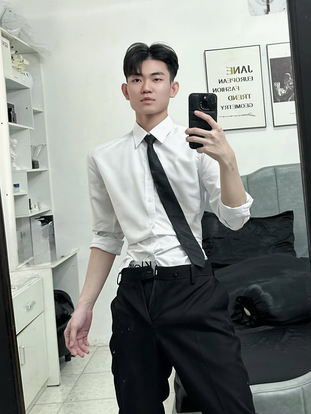 Photo by Trần Võ Nhật Kiên on February 16, 2026. May be an image of bolo tie, suit and text.