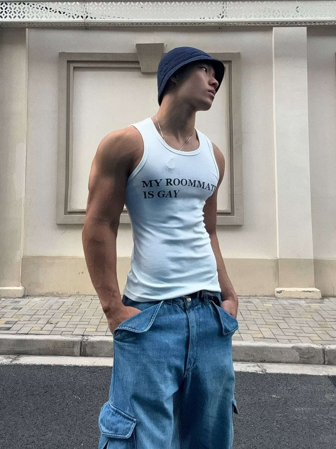 Photo by zhenhao_cai on December 12, 2025. May be an image of one or more people, biceps, people bodybuilding, activewear, sportswear, sweatpants, tanktop and text that says 'MYROOMMAT ROOMMAT'.