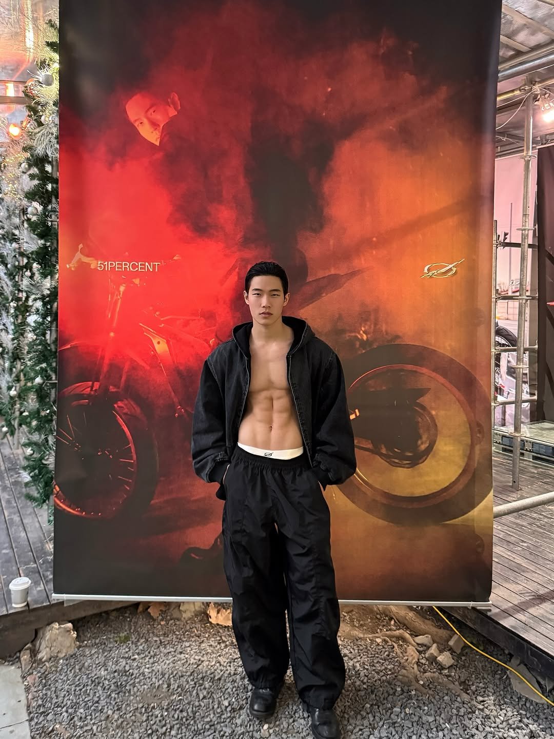 Photo shared by zhenhao_cai on December 23, 2025 tagging @51percent_official, and @bloop______bloop. May be an image of standing, fire, costume, poster, gas mask and text that says '51PERCENT 51PERCENT'.