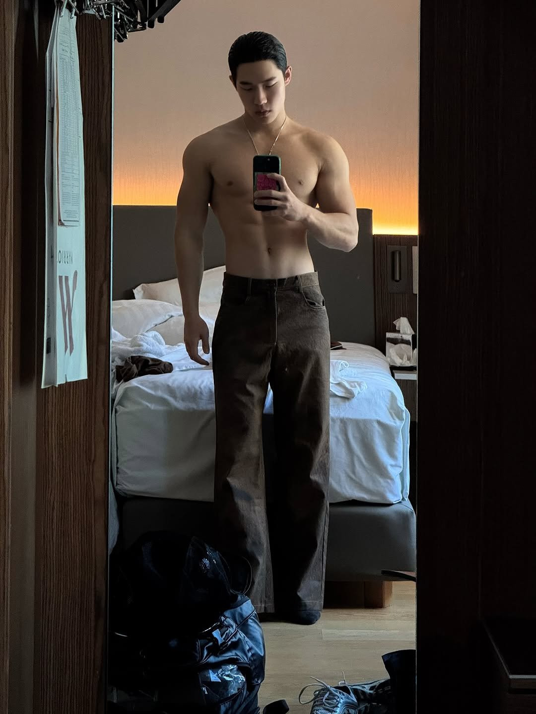 Photo by zhenhao_cai on December 13, 2025. May be an image of one or more people, mirror, sweatpants and text.