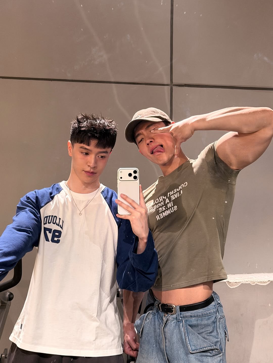 Photo shared by zhenhao_cai on April 01, 2026 tagging @krystianwang. May be a selfie of one or more people, biceps, hair, mirror and text.