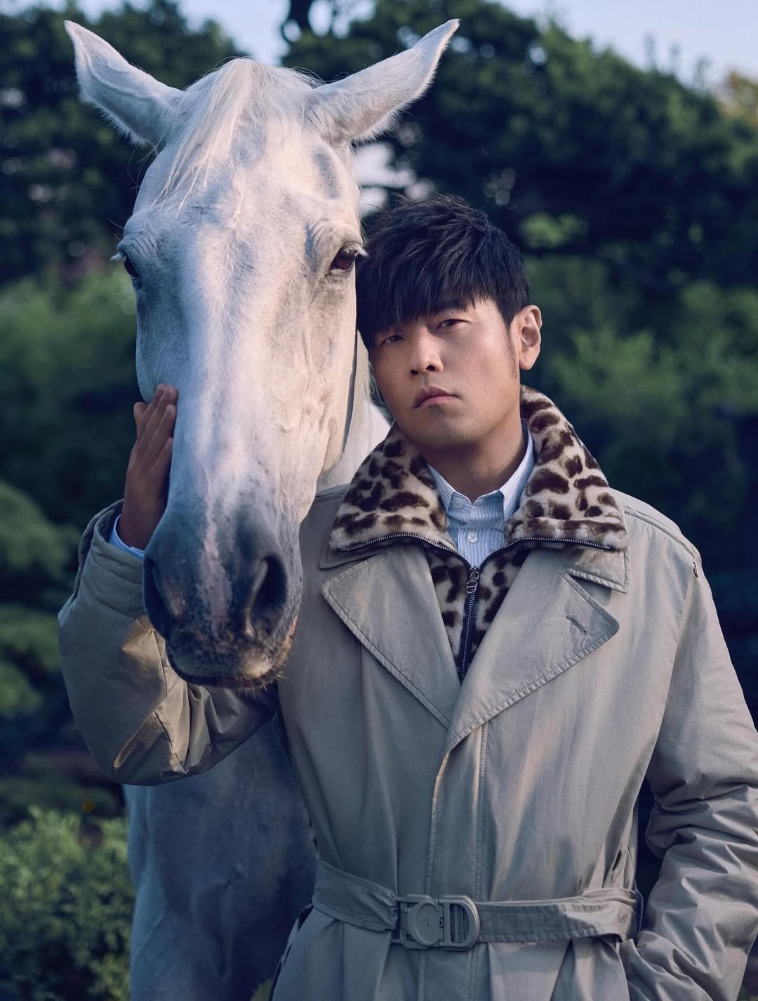 Photo by Jay Chou 周杰倫 on February 17, 2026. May be an image of duffle coat, overcoat, bolo tie, parka and text.