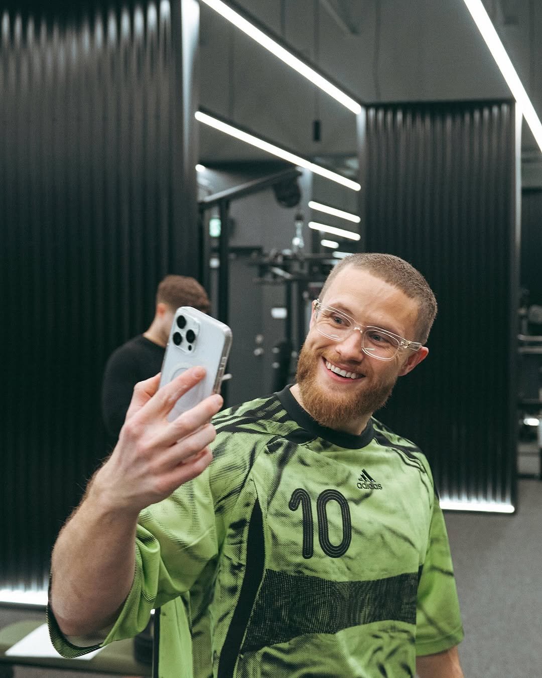 Photo shared by Jeff Nippard on January 30, 2026 tagging @macrofactorapp. May be a selfie of one or more people, beard, people playing soccer, phone, sports equipment, sportswear and stadium.