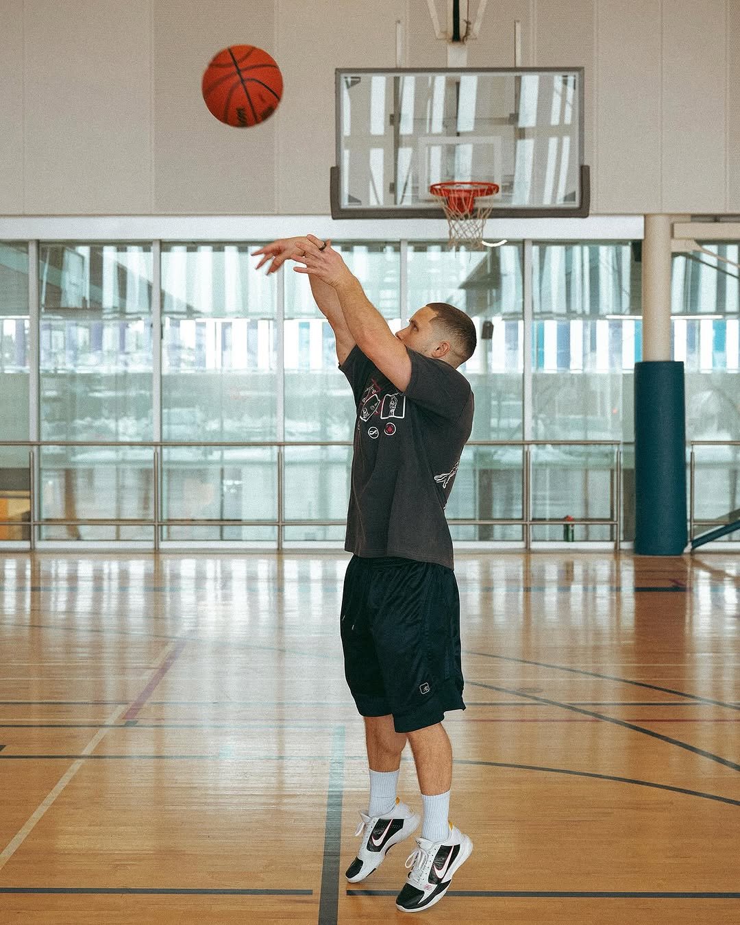 Photo shared by Jeff Nippard on February 20, 2026 tagging @tylorkc. May be an image of basketball, basketball jersey, backboard, ball, basketball court and text.