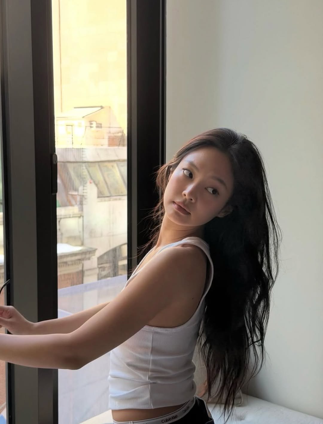 Photo by JENNIE FANPAGE ♡︎ on February 14, 2026. May be an image of one or more people, long hair, sleepwear, bra and text.
