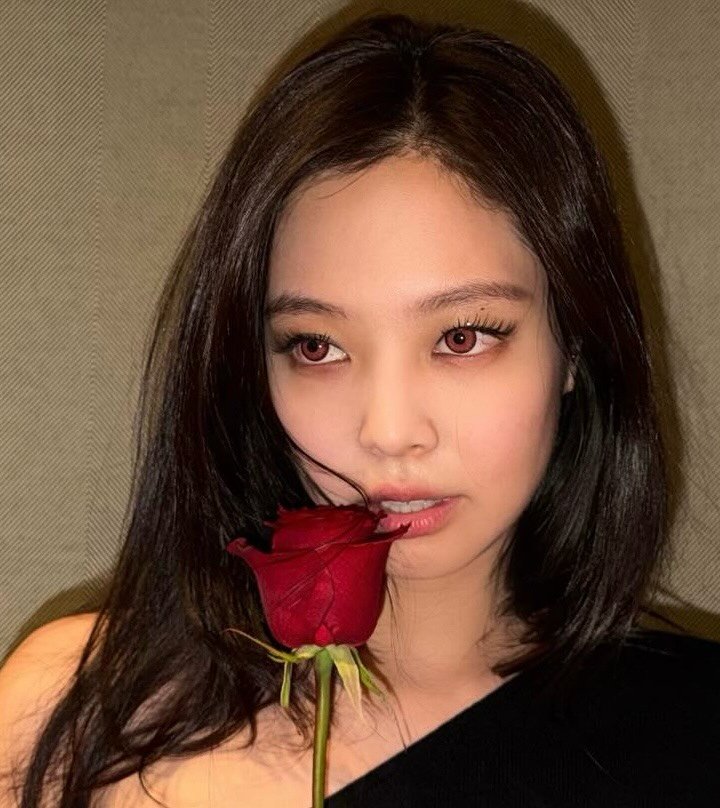 Photo shared by JENNIE FANPAGE ♡︎ on February 06, 2026 tagging @jennierubyjane. May be an image of one or more people, hair, rose and text.