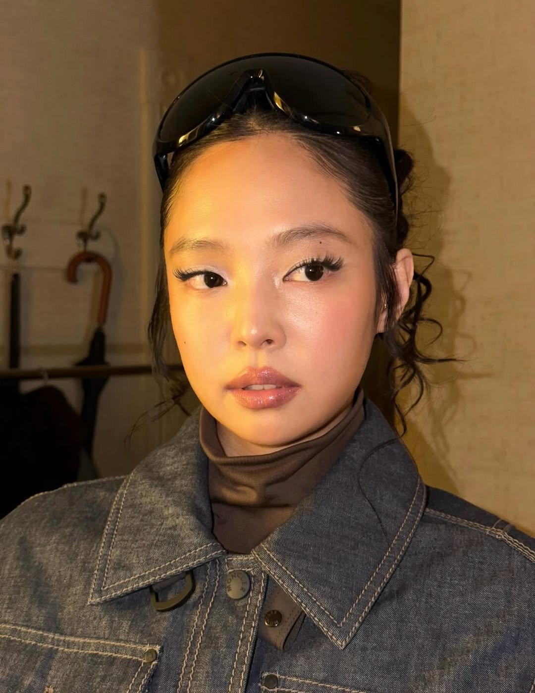 Photo shared by JENNIE FANPAGE ♡︎ on February 01, 2026 tagging @jennierubyjane. May be an image of one or more people, hair, makeup, eyewear, turtleneck and text.
