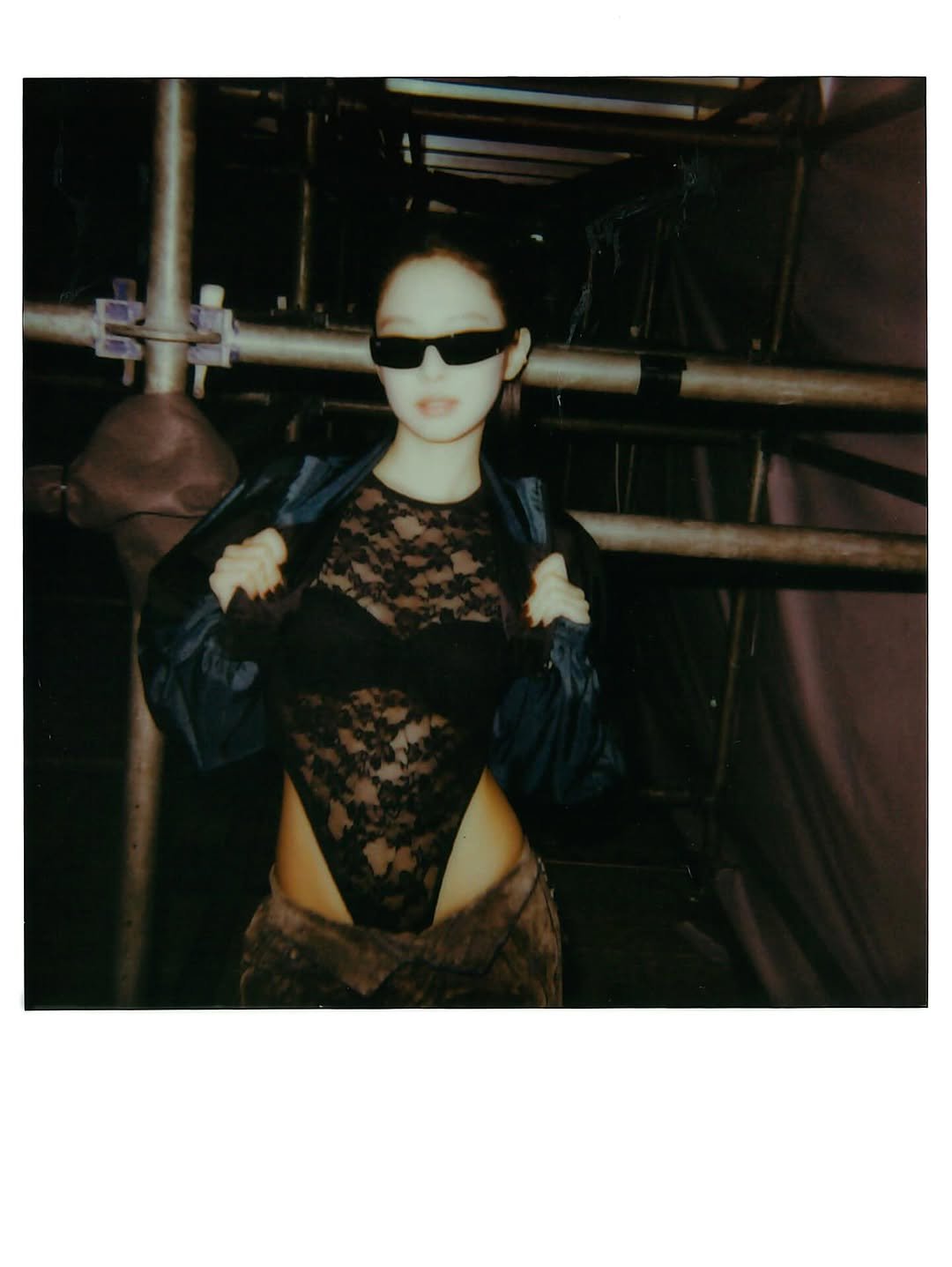 Photo by J on October 30, 2025. May be an image of polaroid, fishnet stockings, glasses and text.
