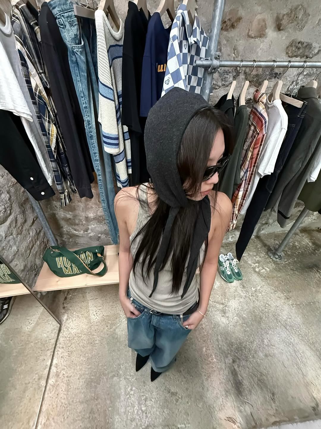 Photo by J on October 05, 2025. May be an image of 1 person, hat, scarf, beret, outerwear, hat shop and text.