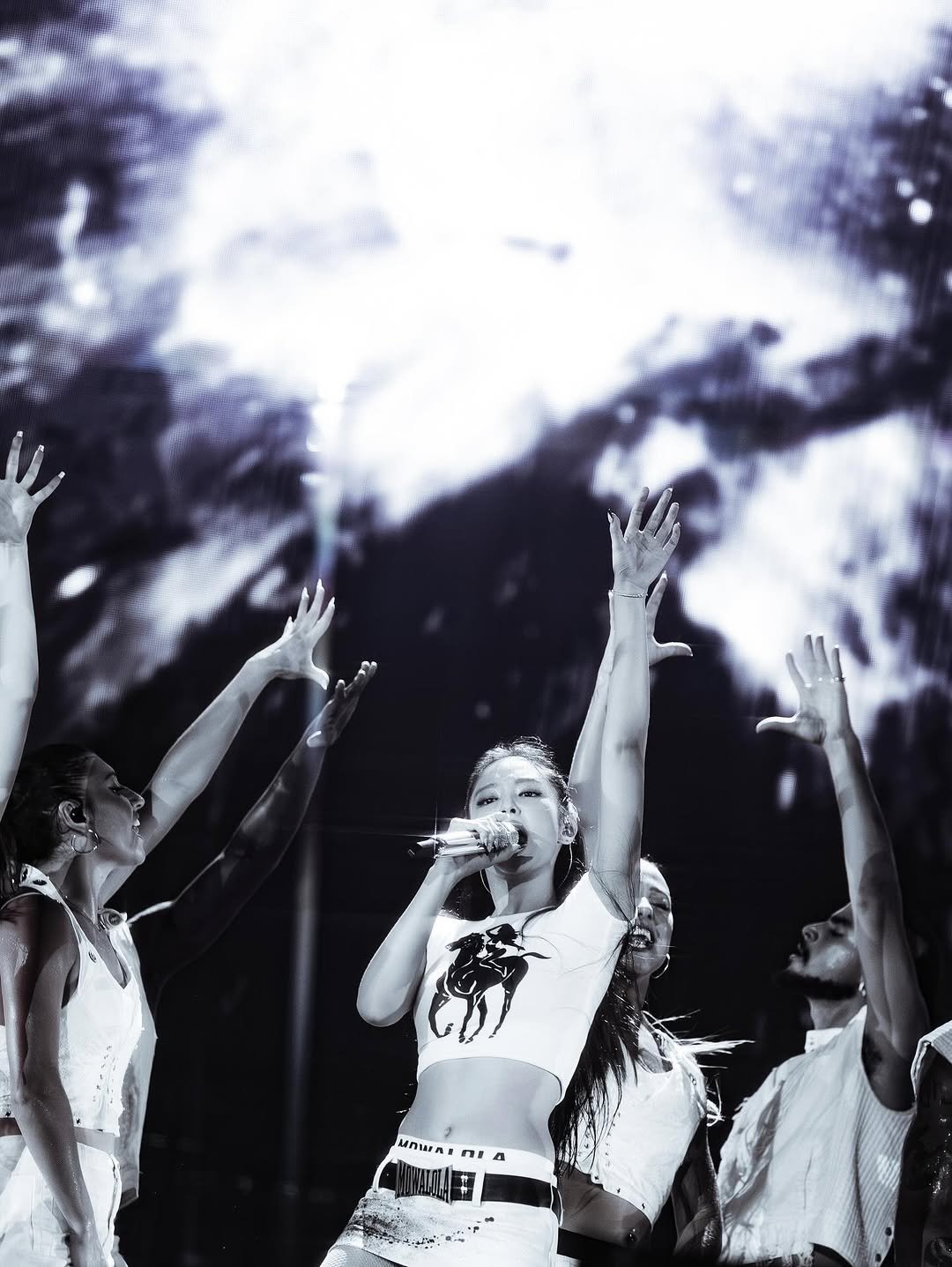 Photo by J on October 23, 2025. May be a black-and-white image of dancing, saxophone, crowd, concert and text.